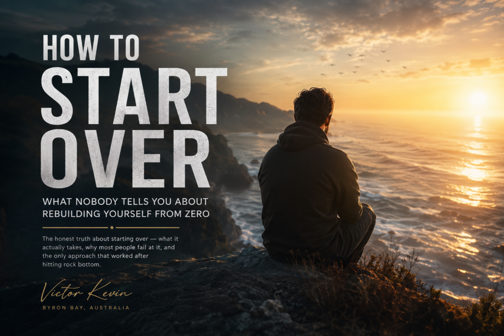 A lone man sitting on a rocky coastal cliff at sunrise, looking over the ocean as golden light breaks through dark clouds — symbolizing rebuilding life after failure and starting over